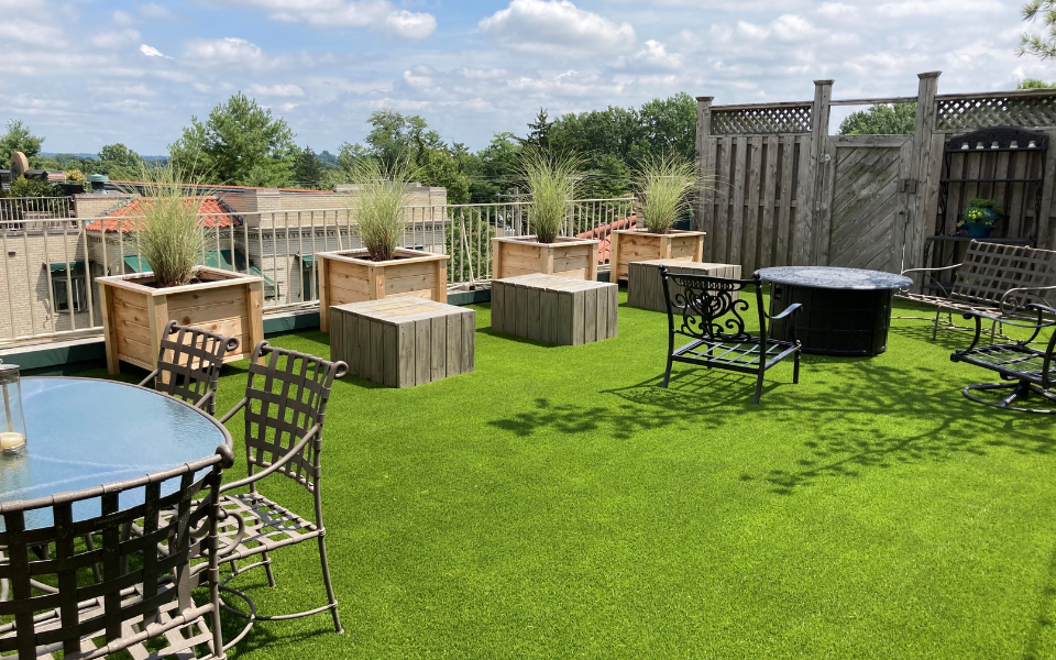 Turf on rooftop with tables and chairs